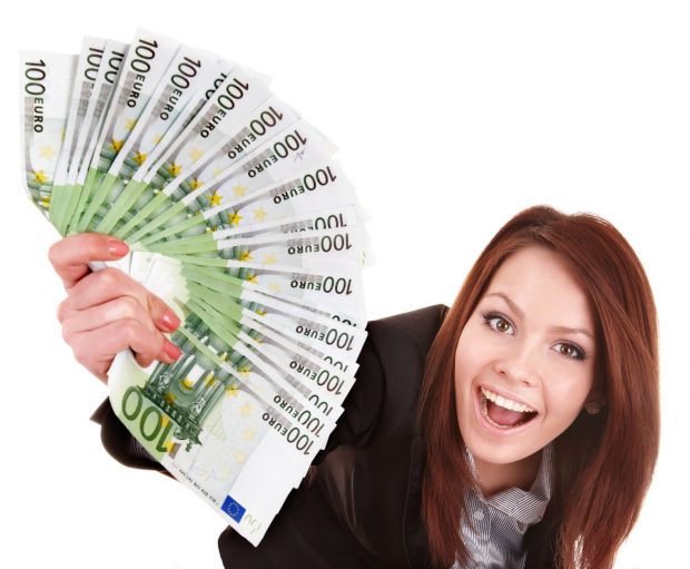 Young woman holding euro money.  Isolated.